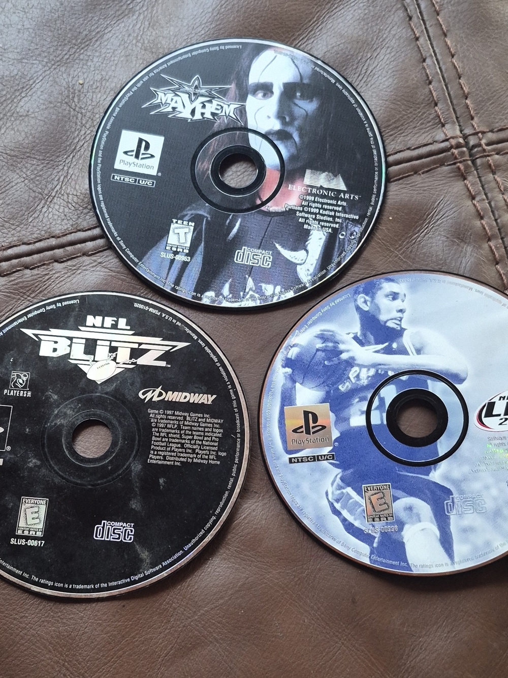 Three PlayStation Game Discs - NFL Blitz, NBA Live & Mayhem